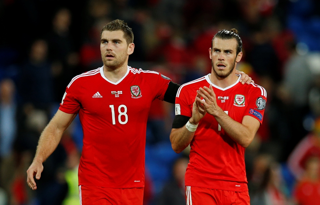Wales' Gareth Bale and Sam Vokes look dejected after the match. Reuters / Andrew Couldridge