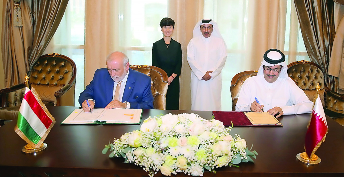 Minister of Transport and Communications H E Jassim bin Saif Al Sulaiti and Dr Pana Petra, the Hungarian Minister of State for Foreign Affairs witnessing the signing of the agreement.