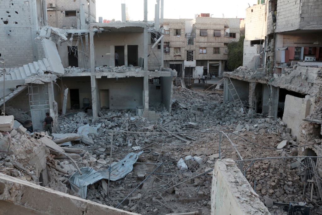 DAMASCUS, SYRIA - OCTOBER 10: Syrians inspect the remains of their houses after war crafts belonging to the Syrian army carried out an airstrike over residential areas at Arbin town of eastern Goutha in Damascus, Syria on October 10, 2016. ( Diaa Al Din -