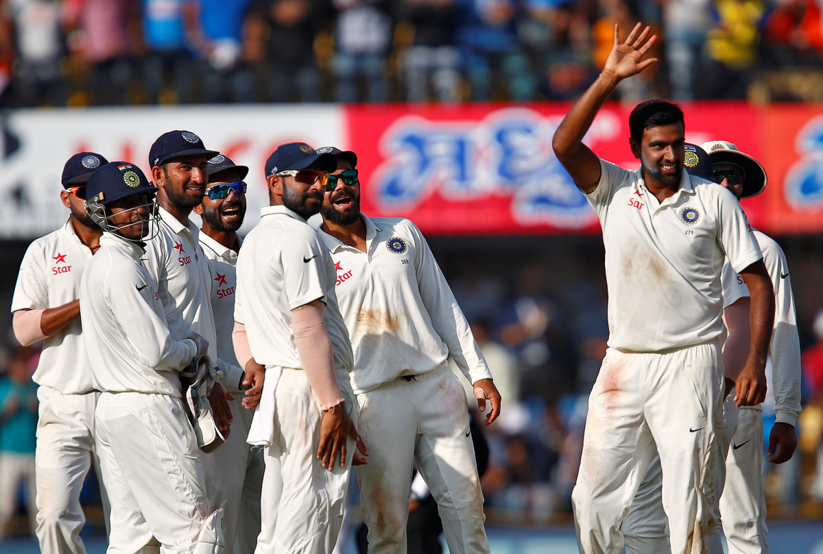 India's Ravichandran Ashwin (R) celebrates after the wicket of New Zealand's Jeetan Patel. (Reuters/Danish Siddiqui)