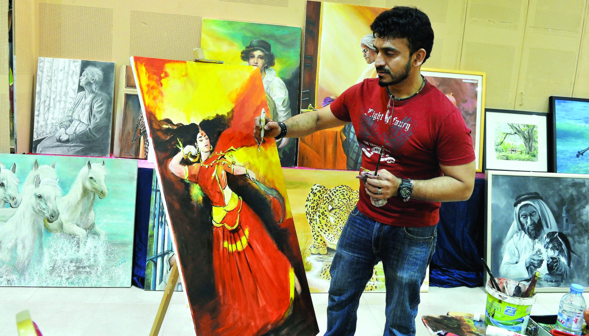 An artist at work during the painting workshop organised by Visual Artists Forum India at the Birla Public School yesterday. Pic: Kammutty V P / The Peninsula