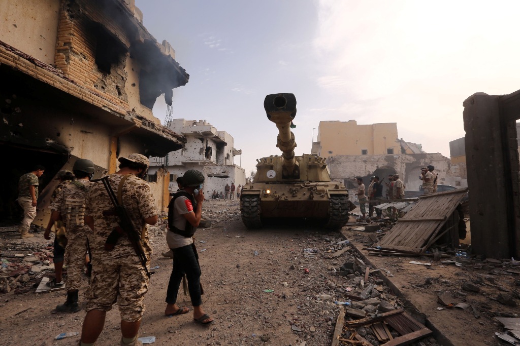 Members of the forces loyal to Libya's UN-backed Government of National Accord (GNA) gather in the coastal city of Sirte, east of the capital Tripoli, during their military operation to clear the Islamic State group's (IS) jihadists from the city, on Octo