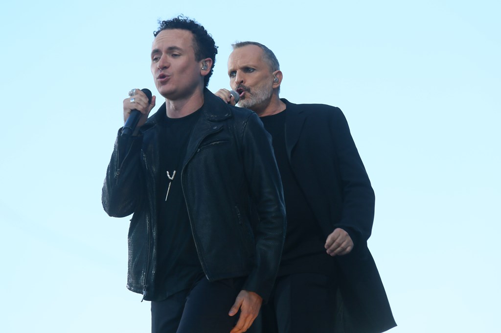 Miguel Bose and Fonseca perform during the 'RiseUp As One' concert at the Cross Border Xpress grounds in Otay Mesa, California on October 15, 2016. AFP / Sandy Huffaker