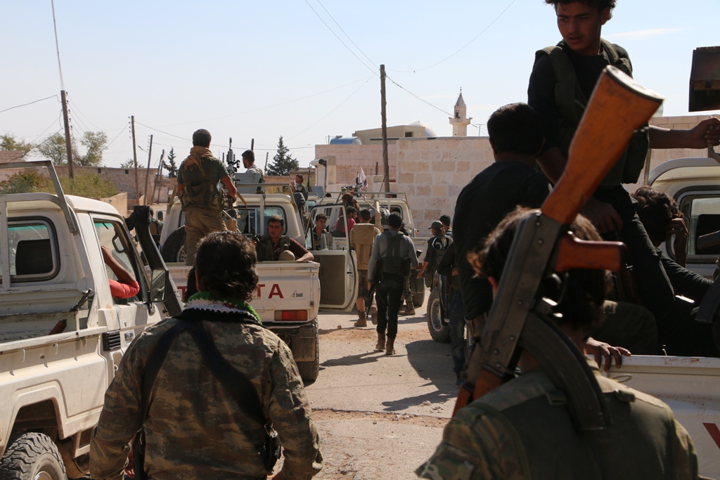 ALEPPO, SYRIA - OCTOBER 15: Members of Free Syrian Army (FSA), Turkish artillery units and coalition air forces on their way during the 