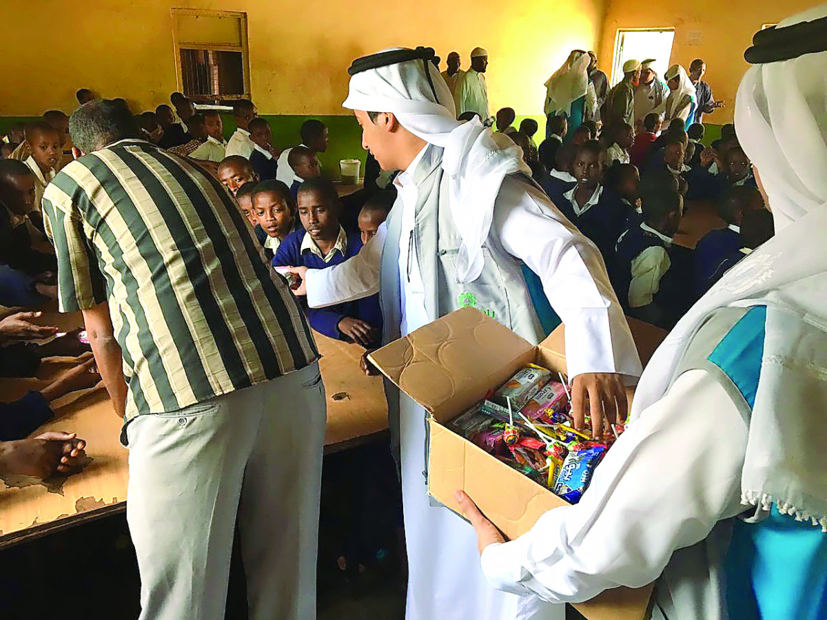 Students distributing gifts to schoolchildren in Kenya.