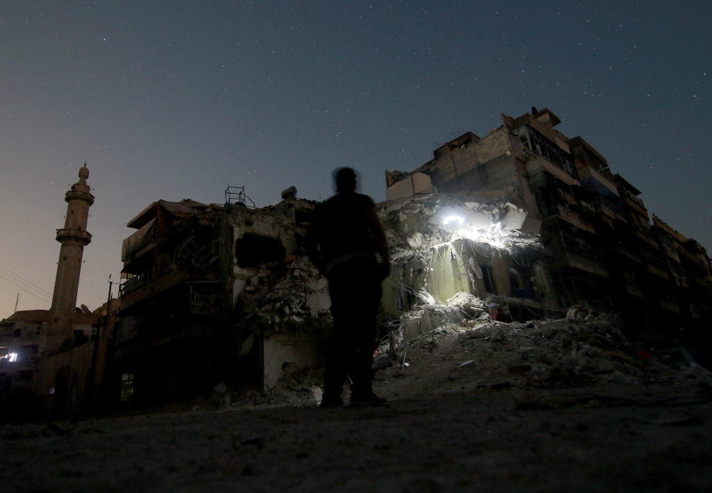 Wreckage of a building is seen after War crafts belonging to the Russian army carried out an airstrike over opposition controlled residential area of Katirci neighborhood of Syria on October 17, 2016. ( Jawad al Rifai - Anadolu Agency )