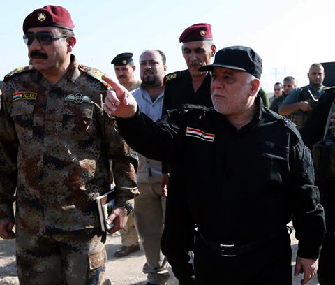 Iraqi Prime Minister Haider al-Abadi (R) inspects Iraqi army's positions during the operation to retake Iraq's Mosul from Daesh, in Mosul, Iraq on October 19, 2016. (Iraqi Prime Ministry Press Office - Anadolu Agency)
