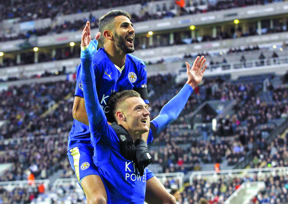 Leicester City’s Jamie Vardy (bottom) celebrates with Riyad Mahrez after scoring a goal against Newcastle United during their Premier League match at St James’ Park in Newcastle, Britain, in this November 21, 2015 file photo.
