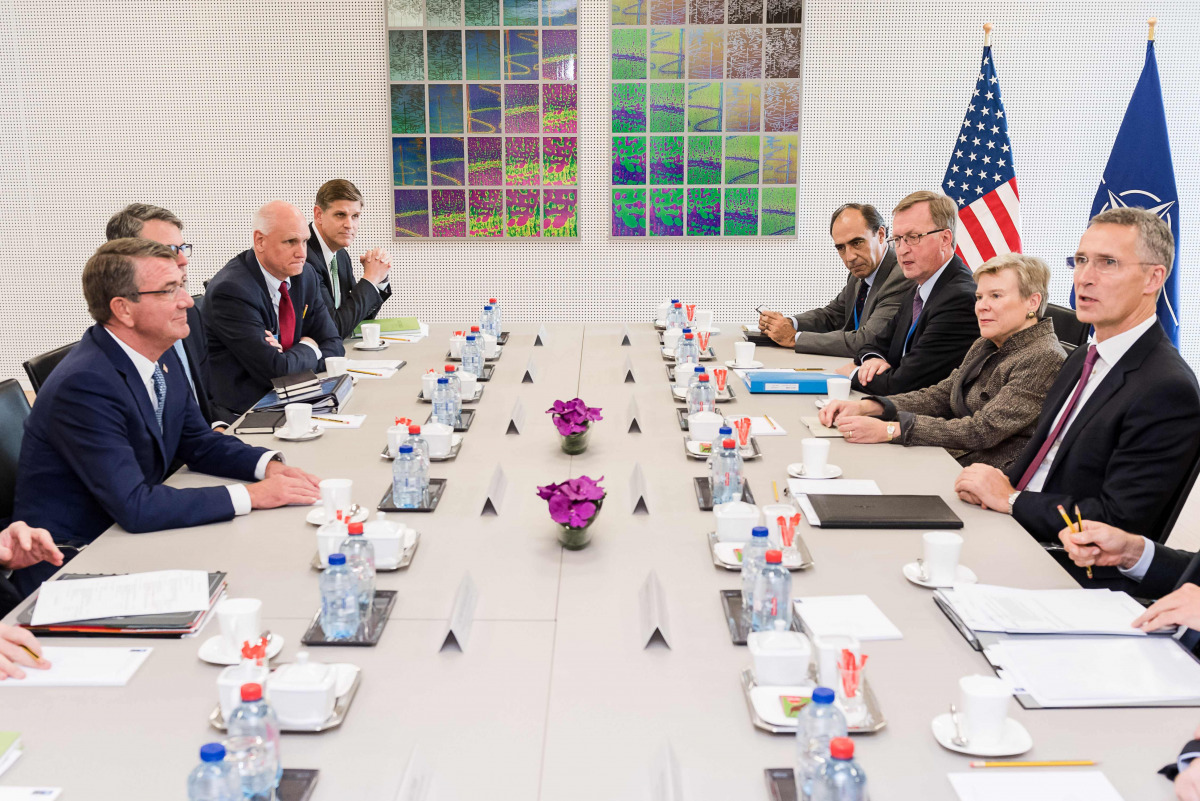 NATO Secretary-General Jens Stoltenberg (R) talks with US Defence Secretary Ashton Carter during a meeting as part of a two-day NATO defence ministers meeting in Brussels on October 26, 2016. NATO defense ministers meet in Brussels to discuss tense relati