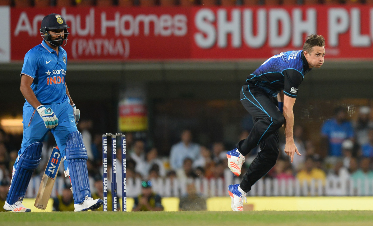 New Zealand's Tim Southee (R) bowls as Indian batsman Rohit Sharma looks on during the fourth one day international (ODI) match between India and New Zealand at The Jharkhand State Cricket Association (JSCA) stadium complex in Ranchi on October 26, 2016. 