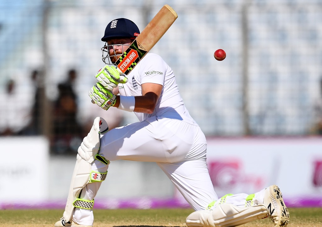 (FILES) This file photo taken on October 22, 2016, shows England's Jonny Bairstow as he plays a shot during the third day of the first Test cricket match between Bangladesh and England at Zahur Ahmed Chowdhury Cricket Stadium in Chittagong. AFP / Dibyangs