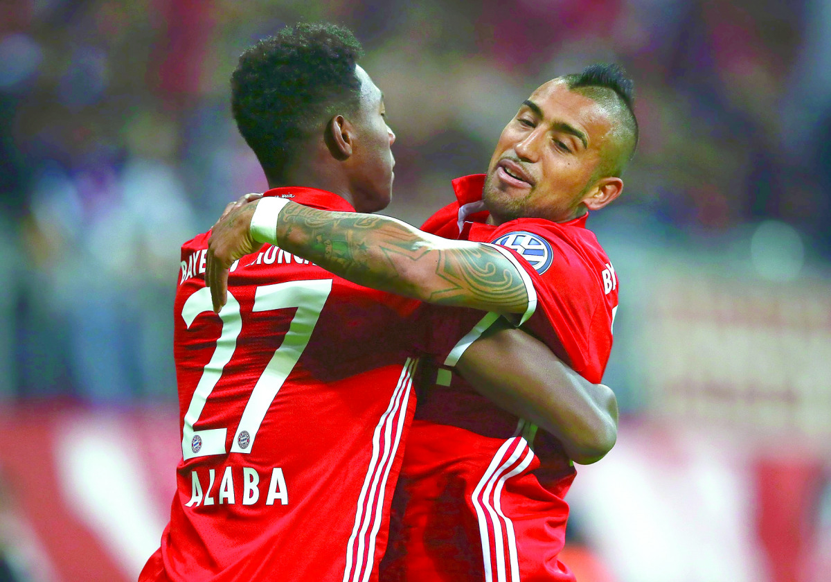 Bayern Munich’s David Alaba and Arturo Vidal react after scoring a goal against FC Augsburg during their match in German Cup (DFB Pokal) at Allianz Arena, Munich, Germany on Wednesday.