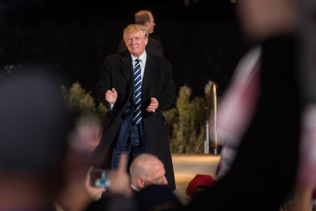 Republican Presidential candidate Donald J. Trump applauds supporters after a rally at the McGrath Amphitheater on October 28, 2016 in Cedar Rapids, Iowa.  David Greedy / AFP
