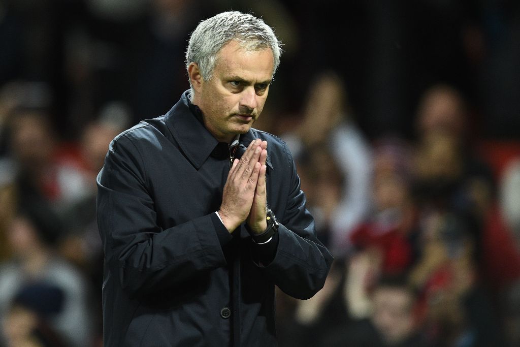 Manchester United's Portuguese manager Jose Mourinho gestures to supporters after the EFL (English Football League) Cup fourth round match between Manchester United and Manchester City at Old Trafford in Manchester, north west England on October 26, 2016.