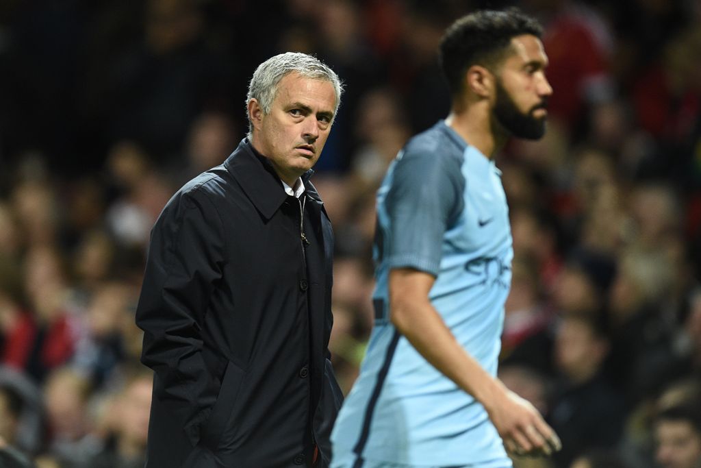 Manchester United's Portuguese manager Jose Mourinho gestures as he walks off at half time in the EFL (English Football League) Cup fourth round match between Manchester United and Manchester City at Old Trafford in Manchester, north west England on Octob