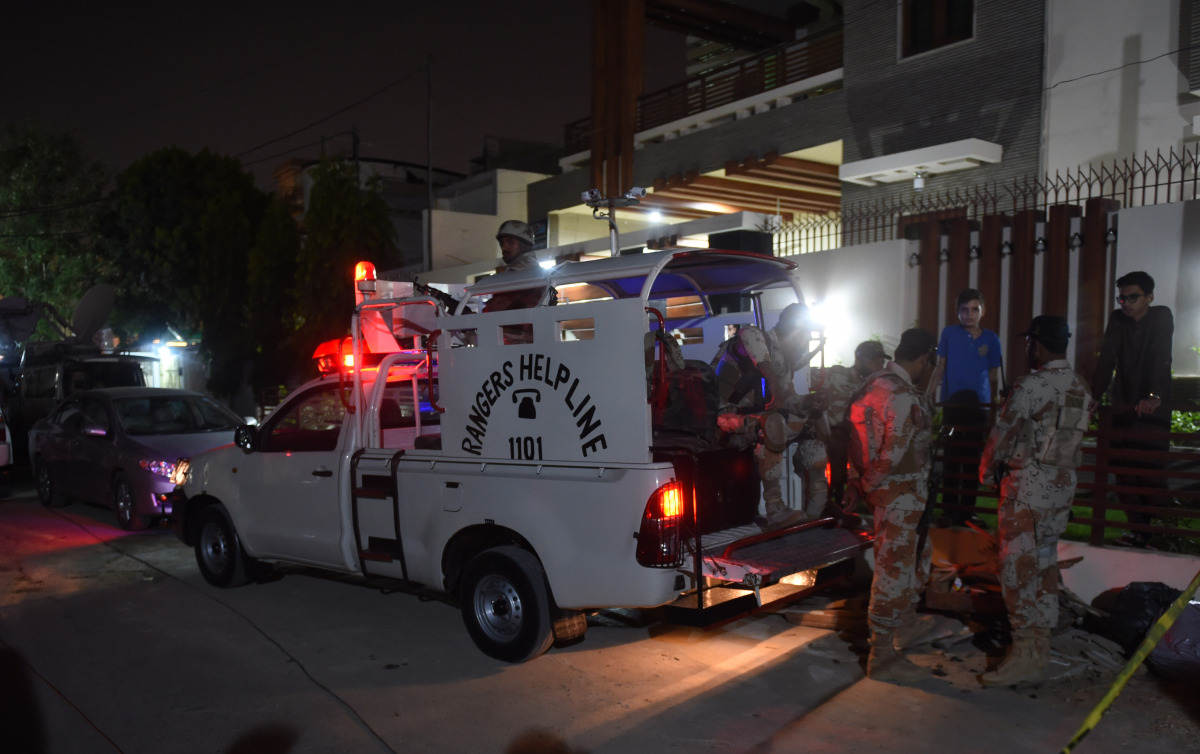 Pakistan Rangers stand guard after the firing incident in Karachi on October 29, 2016. Two gunmen on a motorcycle opened fire on a Shiite Muslim gathering in Pakistan's largest city of Karachi, killing five people, police and hospital officials said. (AFP