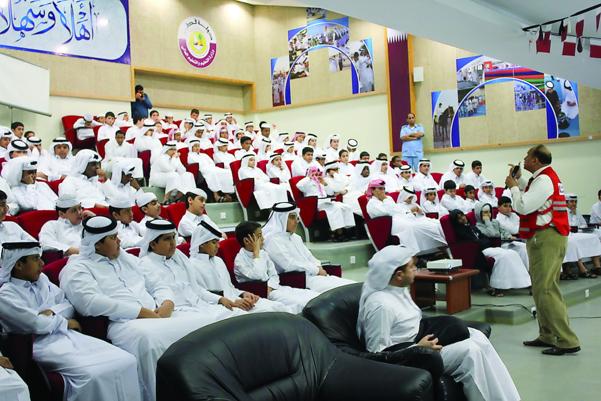 Schoolchildren attending a QRCS lecture.