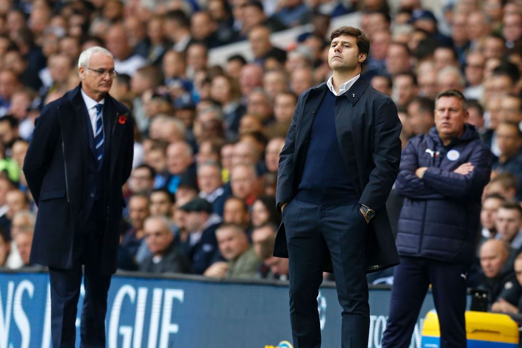 Leicester City's Italian manager Claudio Ranieri (L) and Tottenham Hotspur's Argentinian head coach Mauricio Pochettino gesture on the touchline during the English Premier League football match between Tottenham Hotspur and Leicester City at White Hart La