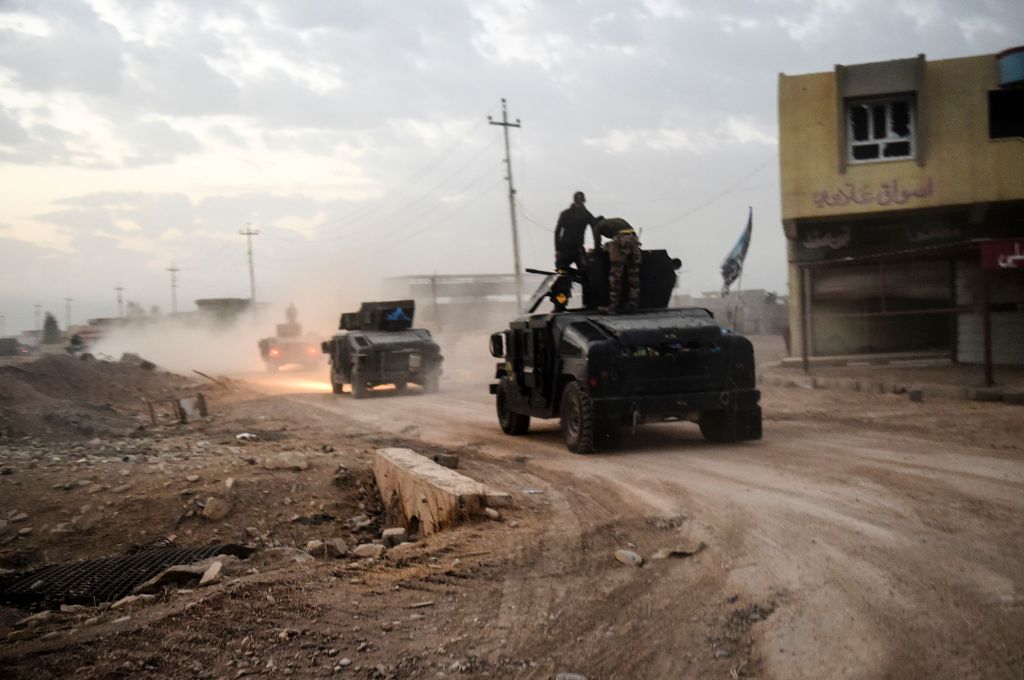  Members of the Iraqi Counter Terrorism Service (CTS) drive near the village of Bazwaya, on the eastern edges of Mosul, tightening the noose on Mosul as the offensive to retake the Islamic State group stronghold entered its third week on October 31, 2016.