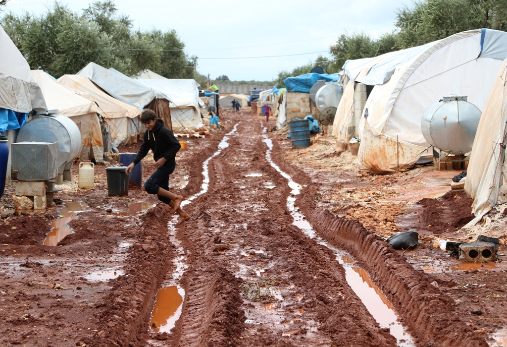 ALEPPO, SYRIA - NOVEMBER 1: A view of a muddy ground tent city which is submerged due to the rain near the Bab al-Salam border gate in Azez district of Aleppo, Syria on November 1, 2016.( Stringer - Anadolu Agency )