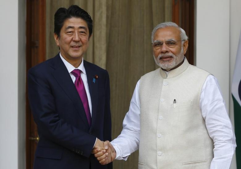 File photo of Japan's Prime Minister Shinzo Abe (L) with his Indian counterpart Narendra Modi in New Delhi. Reuters