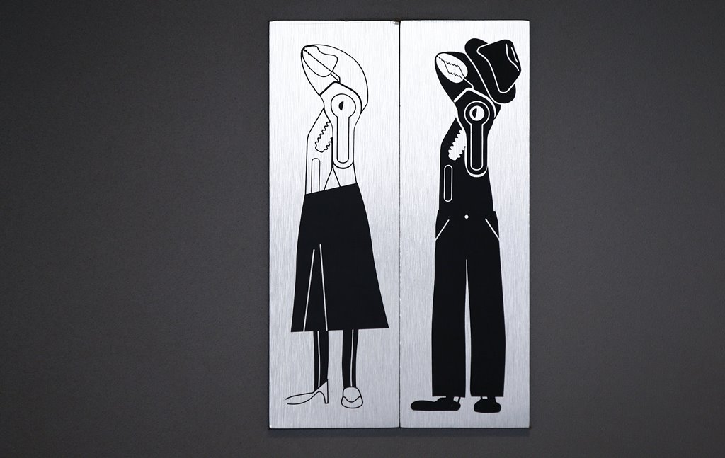 A design showing a female and a male pliers points to the restroom of Knipex, a 130 year-old family-owned pliers and tools maker company in Wuppertal, western Germany, October 26, 2016. Reuters/Wolfgang Rattay
