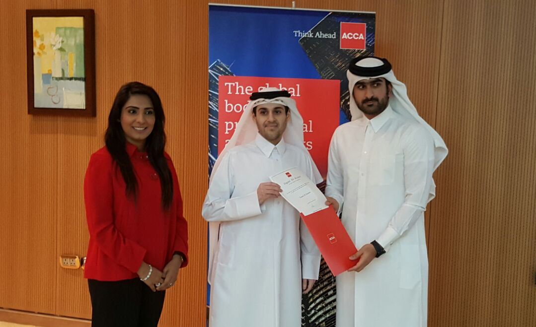 Abdullah Al Jaidah (right) ACCA Member honouring Yousef Al-Naama at the event, as Fazeela Gopalani, ACCA Head of Education looks on.