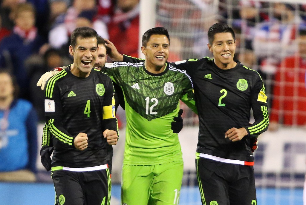 Mexico defender Rafael Marquez (4) and teammates Alfredo Talavera (12) and Hugo Ayala (2) celebrate following the second half against the USA at MAPFRE Stadium. Mexico won the game 2-1. /Joe Maiorana