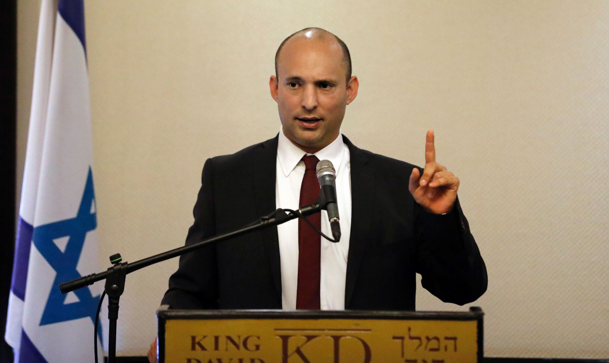 Israeli Education Minister Naftali Bennett (C) who heads the religious nationalist Jewish Home party speaks during a press conference for foreign press association correspondents in Jerusalem on November 14, 2016.
Israel's ministerial committee for legis