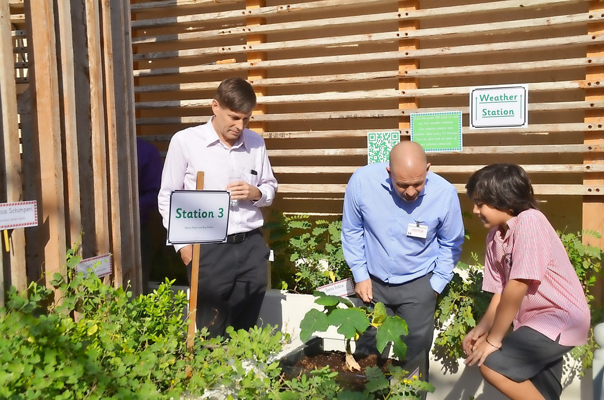 A Doha English Speaking School (DESS) student with Qatar Green Building Council (QGBC) experts during the launch of ‘DESS Community Garden’.
