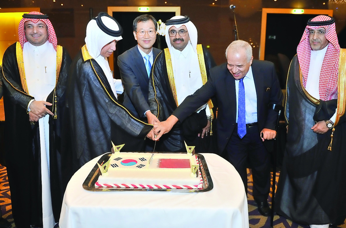 Minister of Energy and Industry H E Dr Mohammed bin Saleh Al Sada, South Korean Ambassador to Qatar Park Heung-Kyeong, and other officials cutting the cake during Korean National Day celebrations at Grand Hyatt Doha Hotel. Pic Baher Amin/ The Peninsula