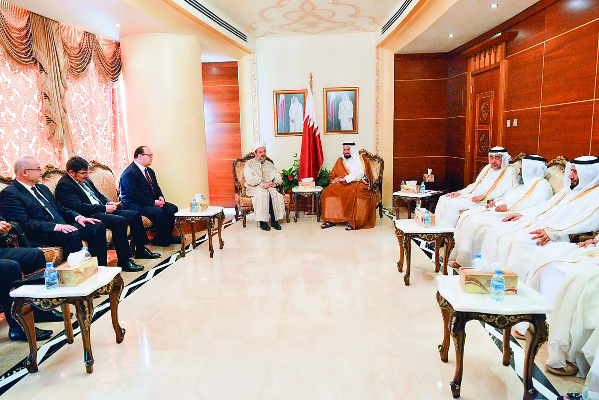 Minister of Awqaf and Islamic Affairs H E Dr Ghaith bin Mubarak Al Kuwari and Qatari officials with the head of the Turkish Department for Religious Affairs, Mohamed Gormaz, and his accompanying delegation in Doha yesterday.
