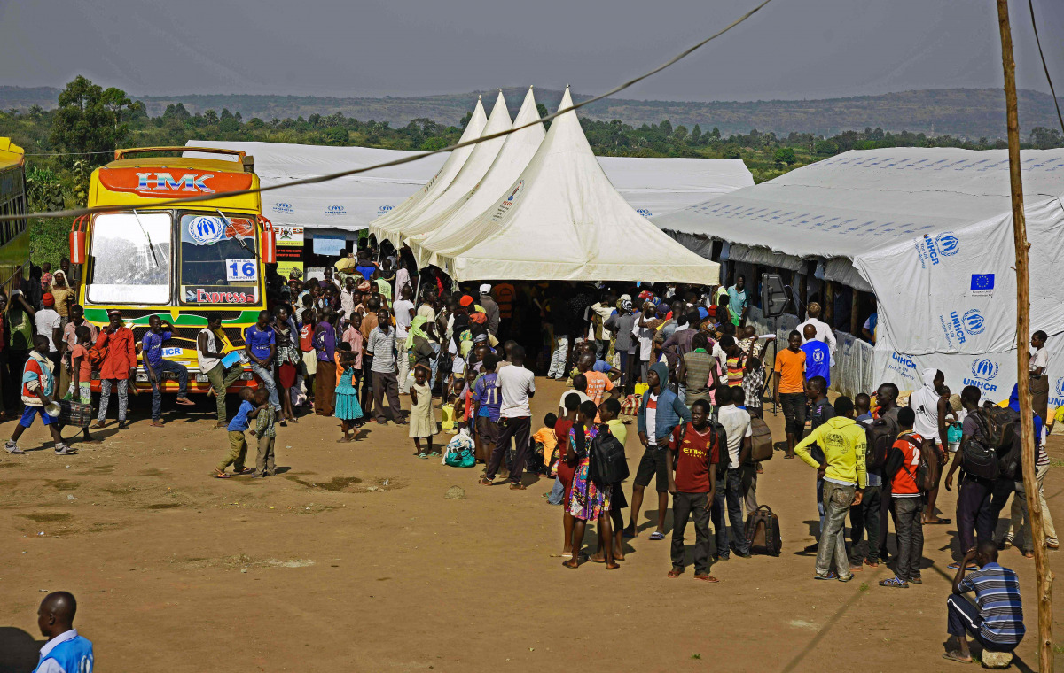 Newly arrived refugees from South Sudan queue in line waiting to be registered on November 11, 2016 at Kuluba Reception Centre in Koboko District, North of the capital Kampala during the EU Commissioner for Humanitarian and Crisis Management visit to Ugan