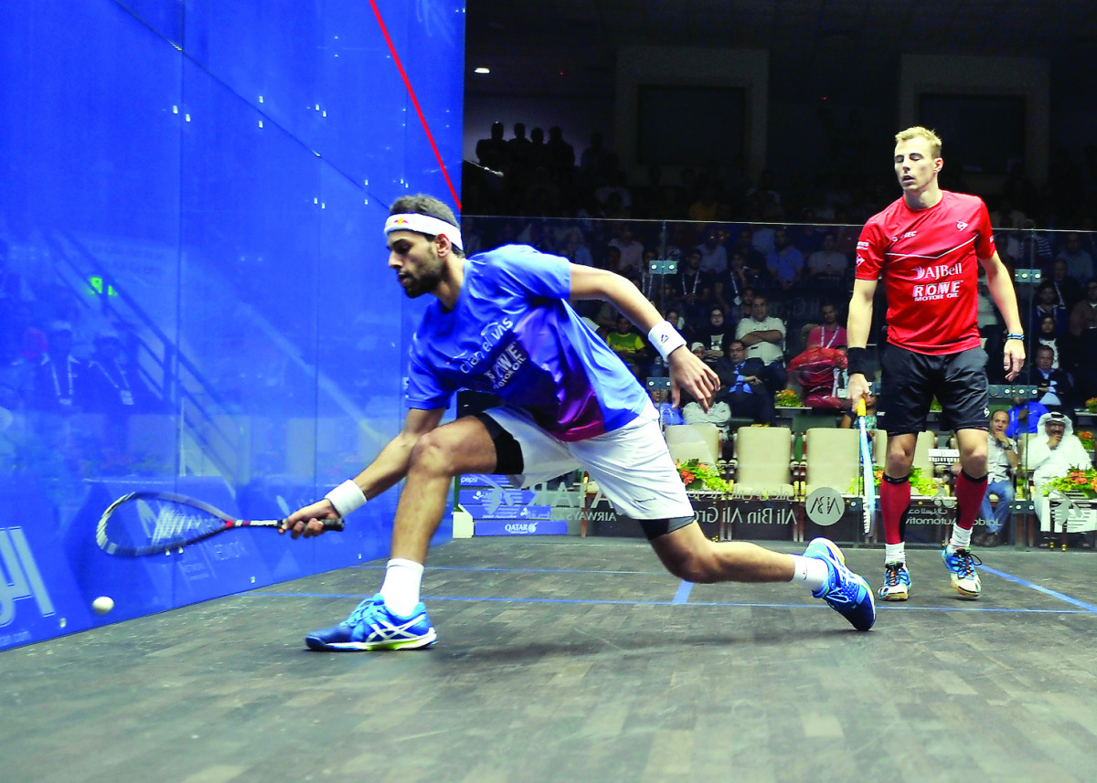 Mohamed Al Shorbagy of Egypt (left) in action against Nick Matthew of England during the Qatar Classic squash championship in Doha yesterday.Pic by : Abdul Basit/The Peninsula
