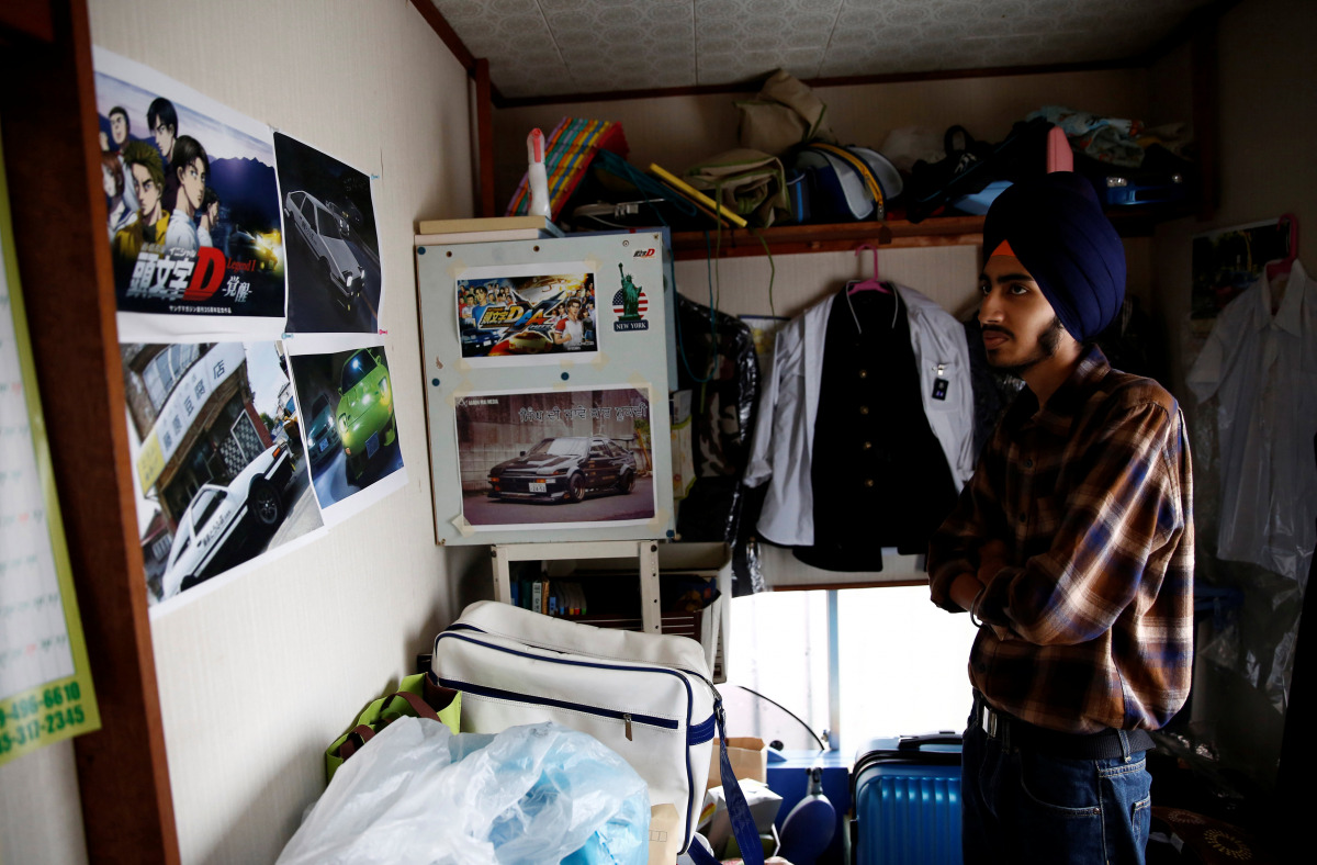 Gursewak Singh looks at posters of Japanese animation on the wall in his room during an interview with Reuters, in Matsudo, Japan, September 25, 2016. Picture taken on September 25, 2016. (REUTERS/Kim Kyung-Hoon)