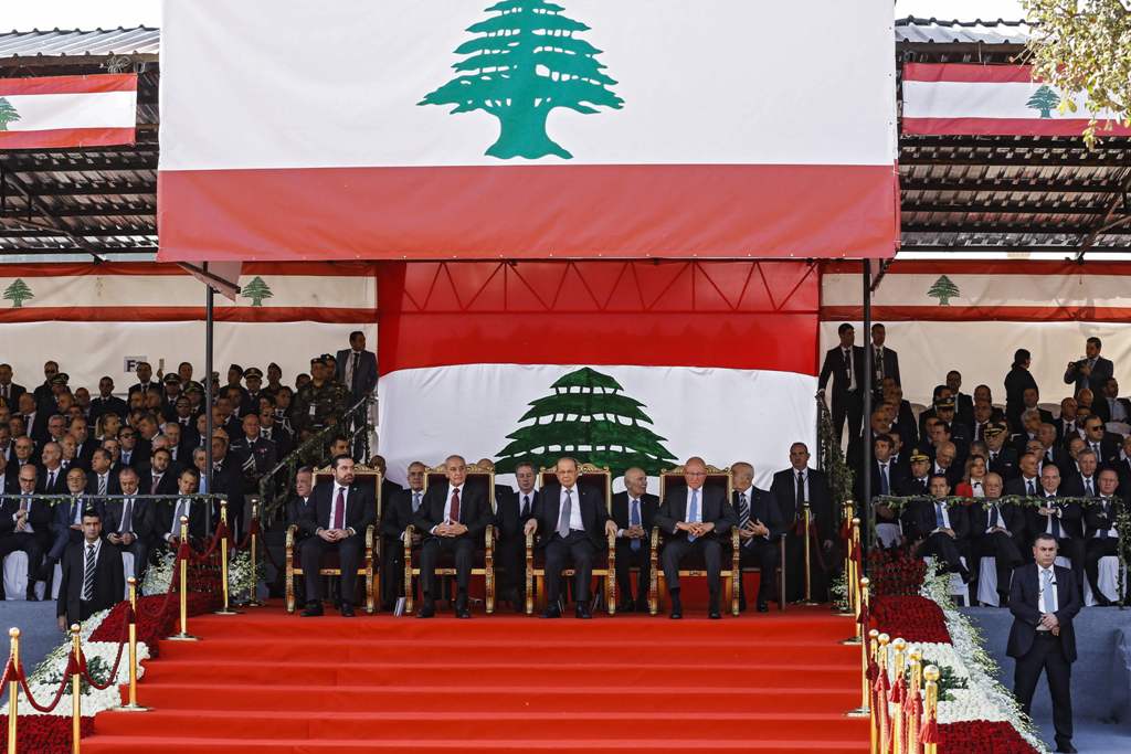 Lebanese President Michel Aoun (C), Parliament Speaker Nabih Berri (C2-L), Caretaker Prime Minister Tamam Salam (C-R) and new Prime Minister Saad Hariri (C3-L) sit during an official ceremony commemorating the country's 73rd independence day in the capita