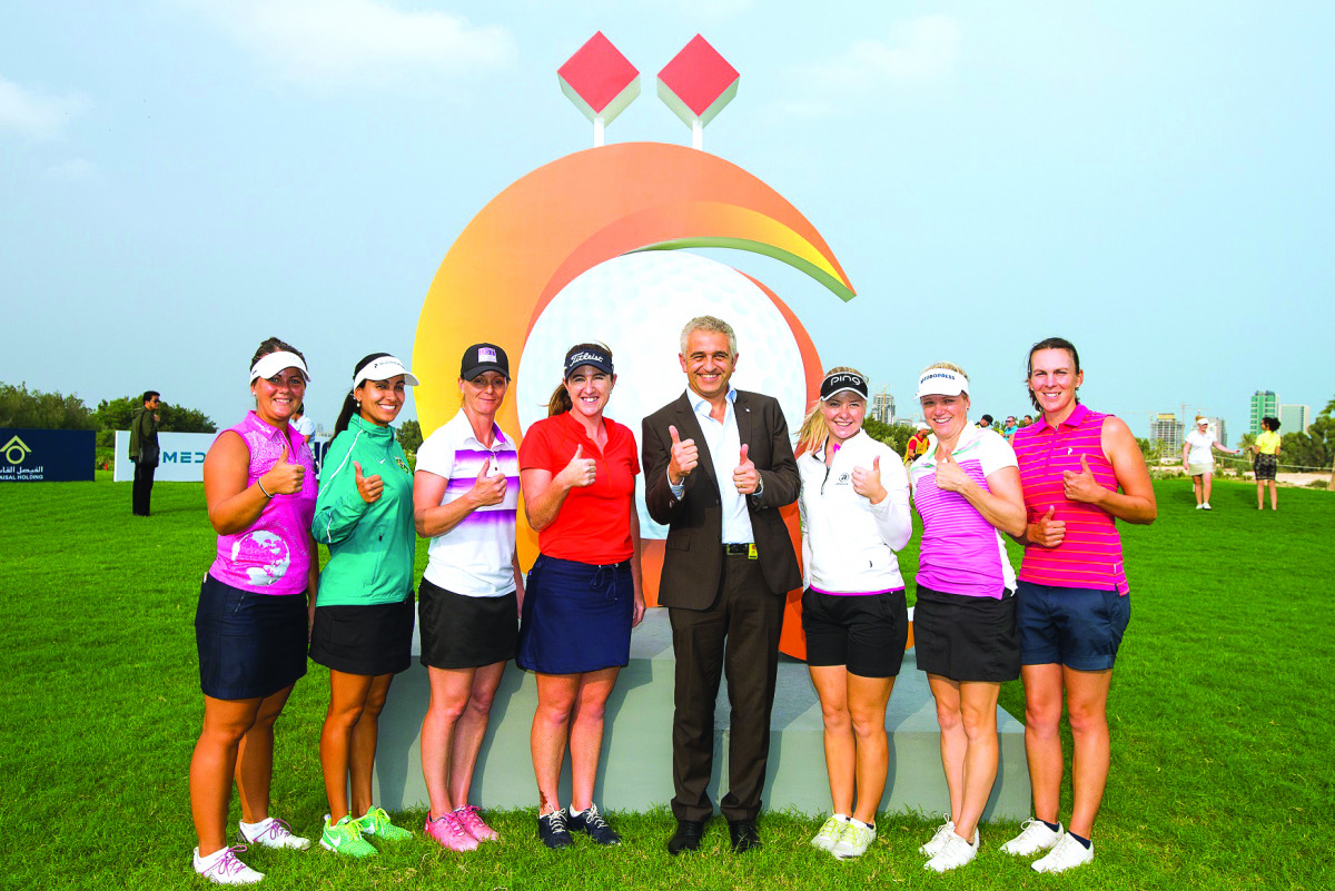 Ladies European Tour CEO Ivan Khodabakhsh poses for a photograph with LET pro's during the  Qatar Ladies Open at Doha Golf Club yesterday.