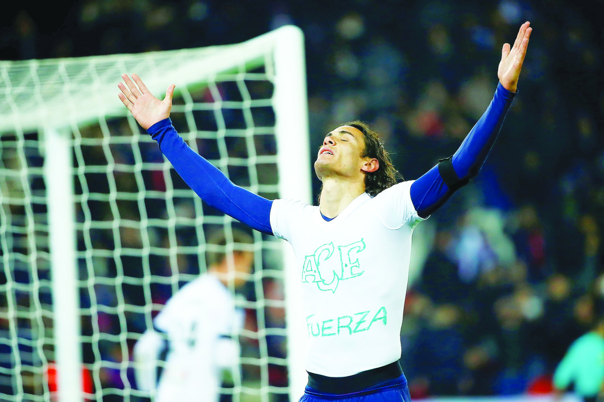Paris Saint-Germain's Edinson Cavani reacts after scoring a goal against Angers during their Ligue 1 match at Parc des Princes in Paris, France on Wednesday. 