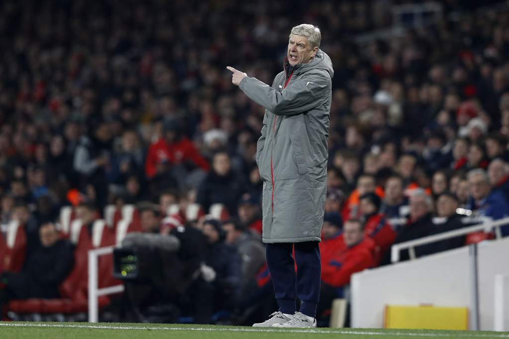 Arsenal's French manager Arsene Wenger shouts instructions to his players from the touchline during the EFL (English Football League) Cup quarter-final football match between Arsenal and Southampton at the Emirates Stadium in London on November 30, 2016. 