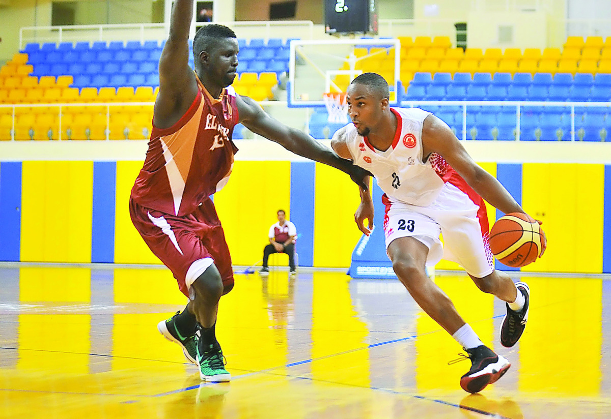 El Jaish's Badron Alione jumps to score a basketball against Al Arabi during their Basketball League match at Al Gharafa Stadium yesterday. RPics by: Baher Amin