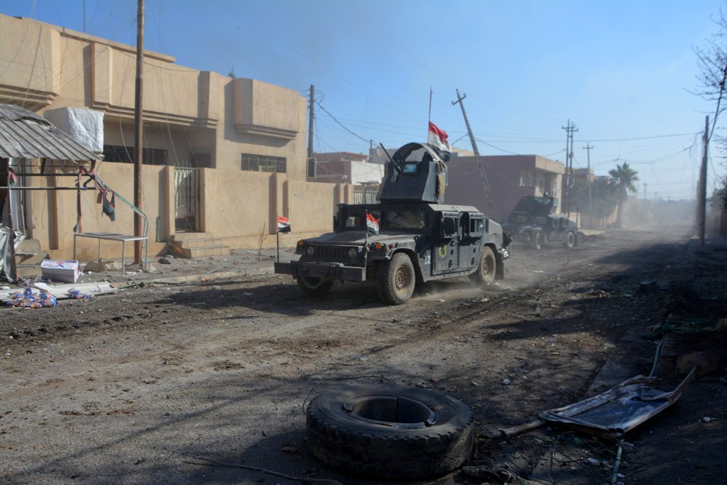 Military vehicles of Iraqi security forces are seen during a battle with Islamic State militants in Mosul, Iraq, December 4, 2016. REUTERS/Stringer

