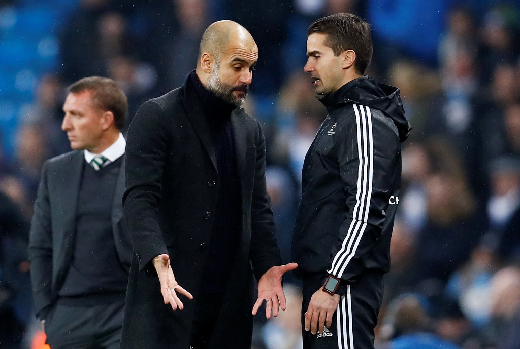  Manchester City manager Pep Guardiola speaks with an official Reuters / Jason Cairnduff
