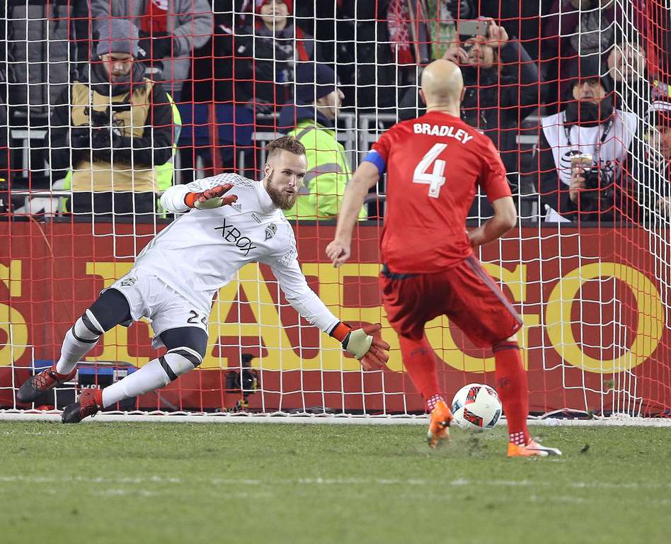 Stefan Frei #24 of the Seattle Sounders stops Michael Bradley #4 of the Toronto FC during the penalty kick phase during the 2016 MLS Cup at BMO Field on December 10, 2016 in Toronto, Ontario, Canada. Claus Andersen/Getty Images/AFP