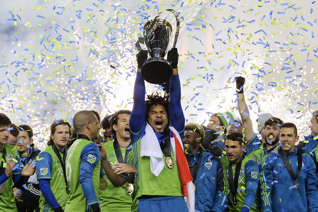 Seattle Sounders defender Roman Torres (29) lifts the Philip F. Anschutz Trophy with his teammates after they defeated Toronto FC in the 2016 MLS Cup at BMO Field. Geoff Burke-USA TODAY Sports