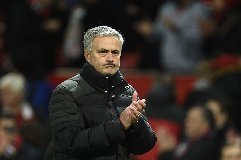Manchester United's Portuguese manager Jose Mourinho applauds after the English Premier League football match between Manchester United and Tottenham Hotspur at Old Trafford in Manchester, north west England, on December 11, 2016. AFP / Oli SCARFF

