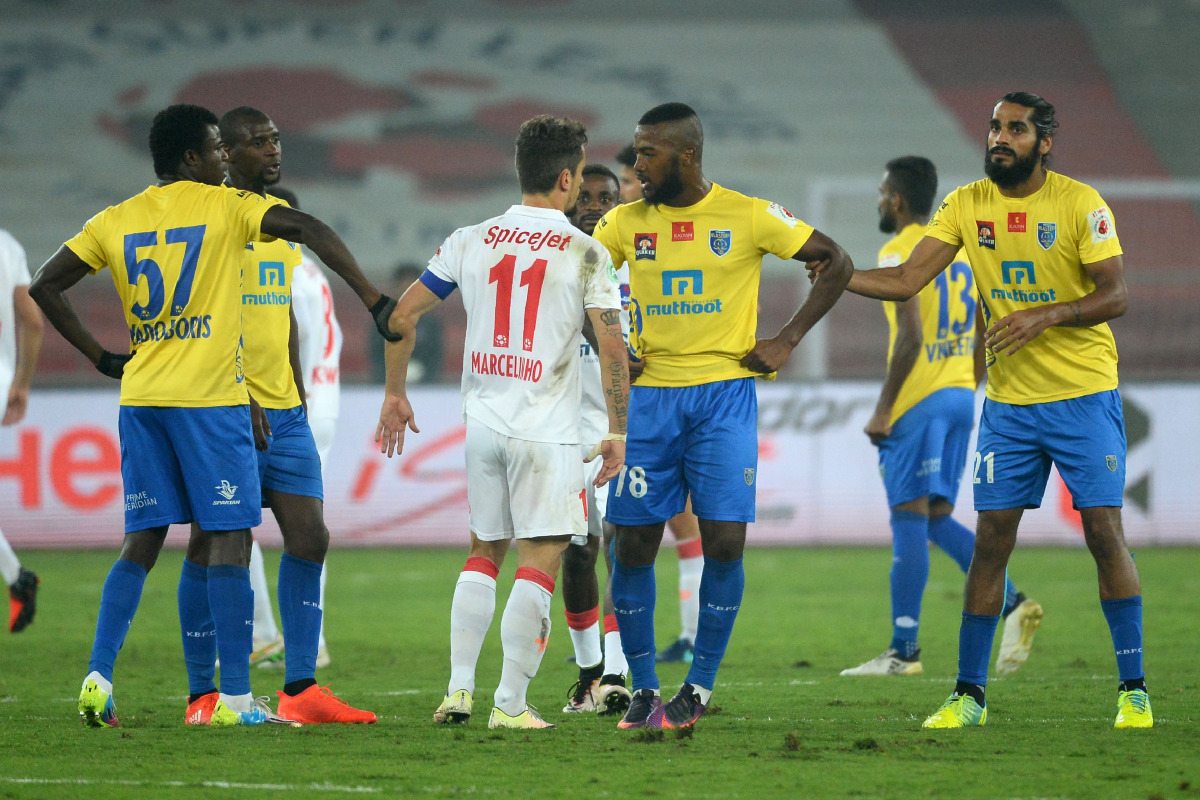 Delhi Dynamos FC forward Marcelo Leite Pereira (C/L) argues with Kerala Blasters FC forward Duckens Nazon (C/R) during the second leg of the second semi-final Indian Super League (ISL) football match between Delhi Dynamos FC and Kerala Blasters FC at The 
