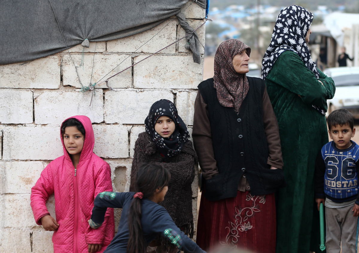 Evacuated civilians, fled from East Aleppo that had been under siege by Iran-led Shiite militias and Assad Regime forces, are being placed to a tent camp at Qah town of Idlib, Syria on December 16, 2016  (?brahim Erikan - Anadolu Agency)