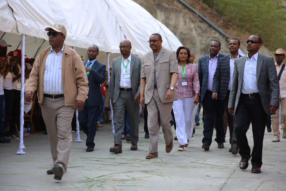 Ethiopia's Prime Minister Haile Mariam Dessalegn (C) attends the inauguration ceremony of the Gibe III dam in the Omo Valley on December 17, 2016. Ethiopia today inaugurated a hydroelectric dam that aims to double the country's electricity output, but whi