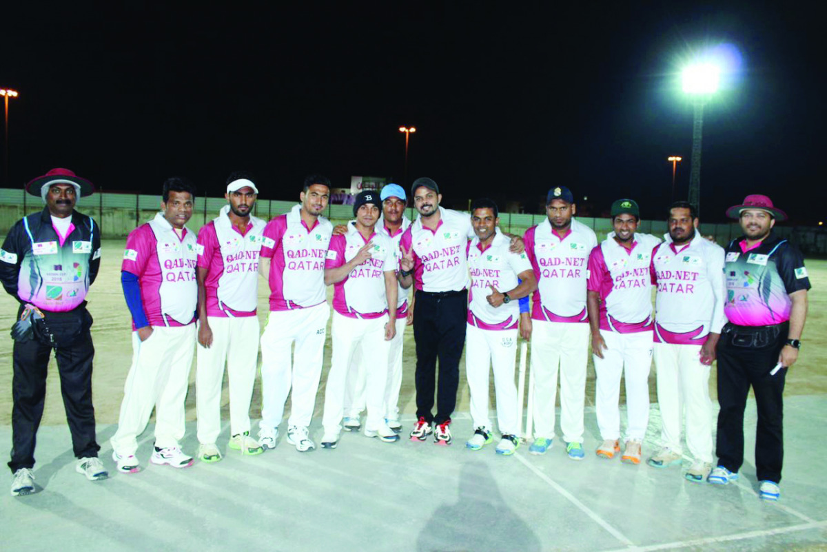 The Qad Net Qatar Team players pose for a photograph with Sreesanth during the opening day of the tournament.