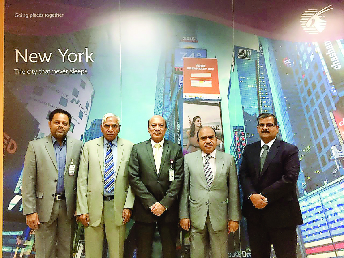Qatar Airways and Qatar Cricket Association officials pose for a photograph after signing the sponsorship agreement for the National Cricket League.